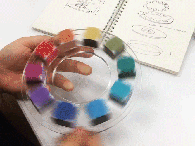 a spinning color wheel, where each color is made of dice.